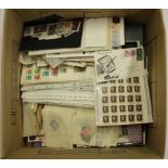 A large box of mixed loose stamps.