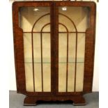 An Art Deco walnut veneered display cabinet, W. 87cm H. 120cm.