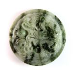 A Chinese carved jade/hardstone buckle. Dia. 5.8cm.