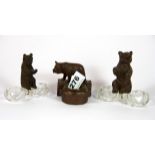 Two glass and Black Forest bear salts, and a further bear with brass bowl, H. 9cm.