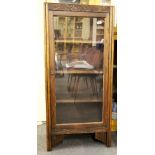 A 1930's oak bookcase, 60cm x 30cm x 121cm.