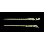 A pair of Chinese carved nephrite jade hair pins topped with standing cranes, L. 20/18cm.