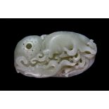 A mid 20th century Chinese carved nephrite jade desk ornament on the shape of a crab pot and fish