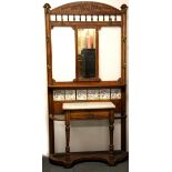 A 19th century carved oak hall stand, inset with tiles, W. 104cm, H. 210cm.