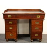 A 19th century mahogany desk with military style handles, W. 101cm.