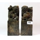 A pair of early to mid 20th century Chinese carved hardstone lion dog figures, H. 21cm.