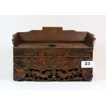 A 19th century Chinese carved wooden desk stand in the form of a throne, 25cm x 15cm x 15cm.