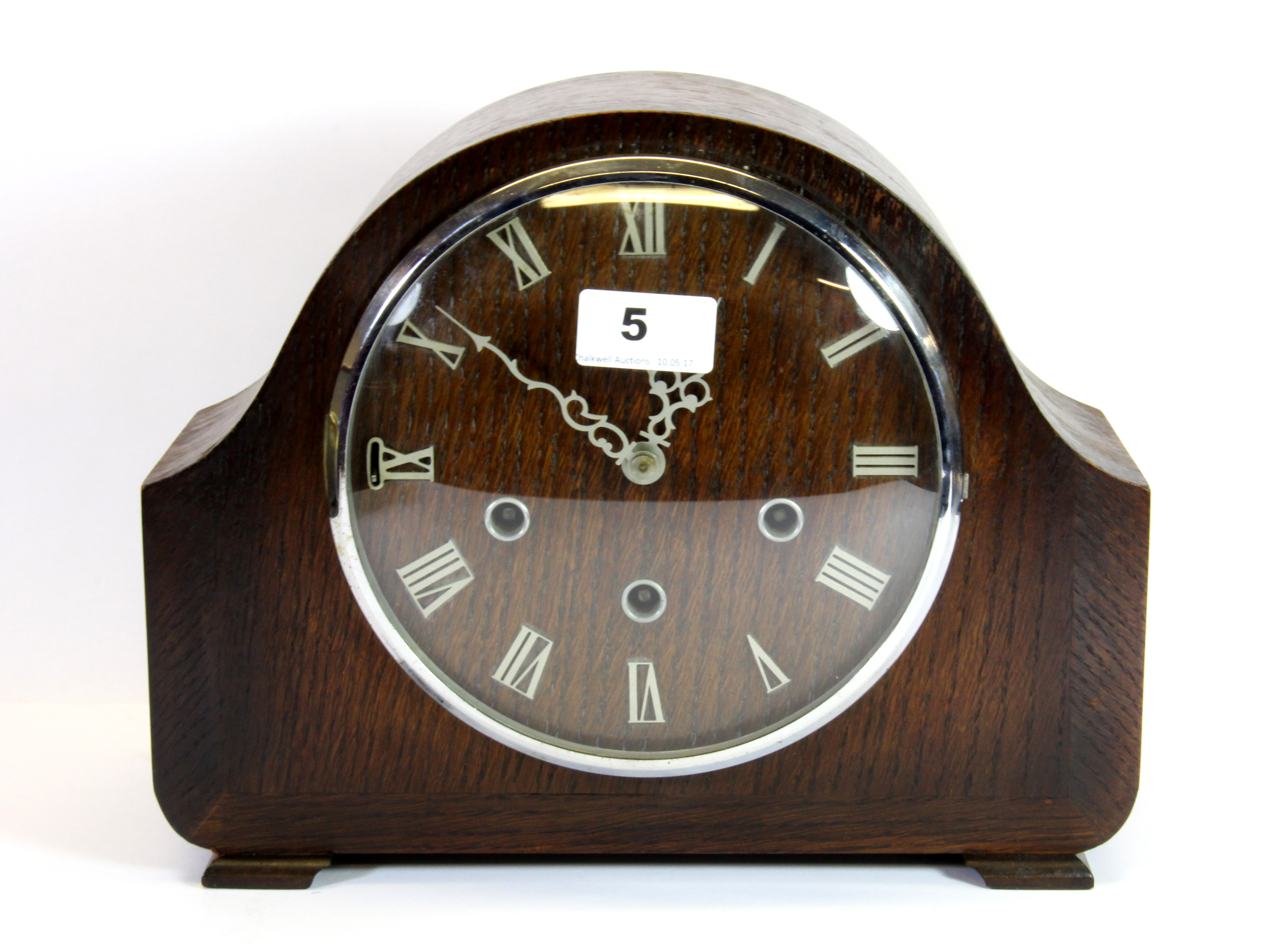 A 1930's chiming oak mantle clock, H. 23cm.