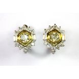 A lovely pair of 14ct yellow and white gold (stamped 585) earrings set with a centre brilliant cut