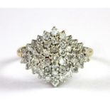 A 9ct yellow gold diamond set cluster ring (J).