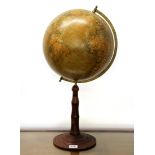 A vintage continental globe on a wooden base, H. 63cm.