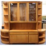 A 1970's William Lawrence teak display cabinet with two matching corner units. Cabinet W. 127cm,