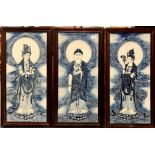 A set of three Chinese hardwood framed relief decorated porcelain panels of the standing Buddha