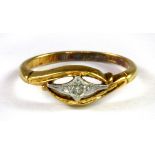 An 18ct yellow and white gold (stamped 18ct) diamond set ring (J.5).