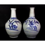 A pair of 17th / 18th century Japanese hand painted porcelain apothecary jars / albarellos, H. 28cm,