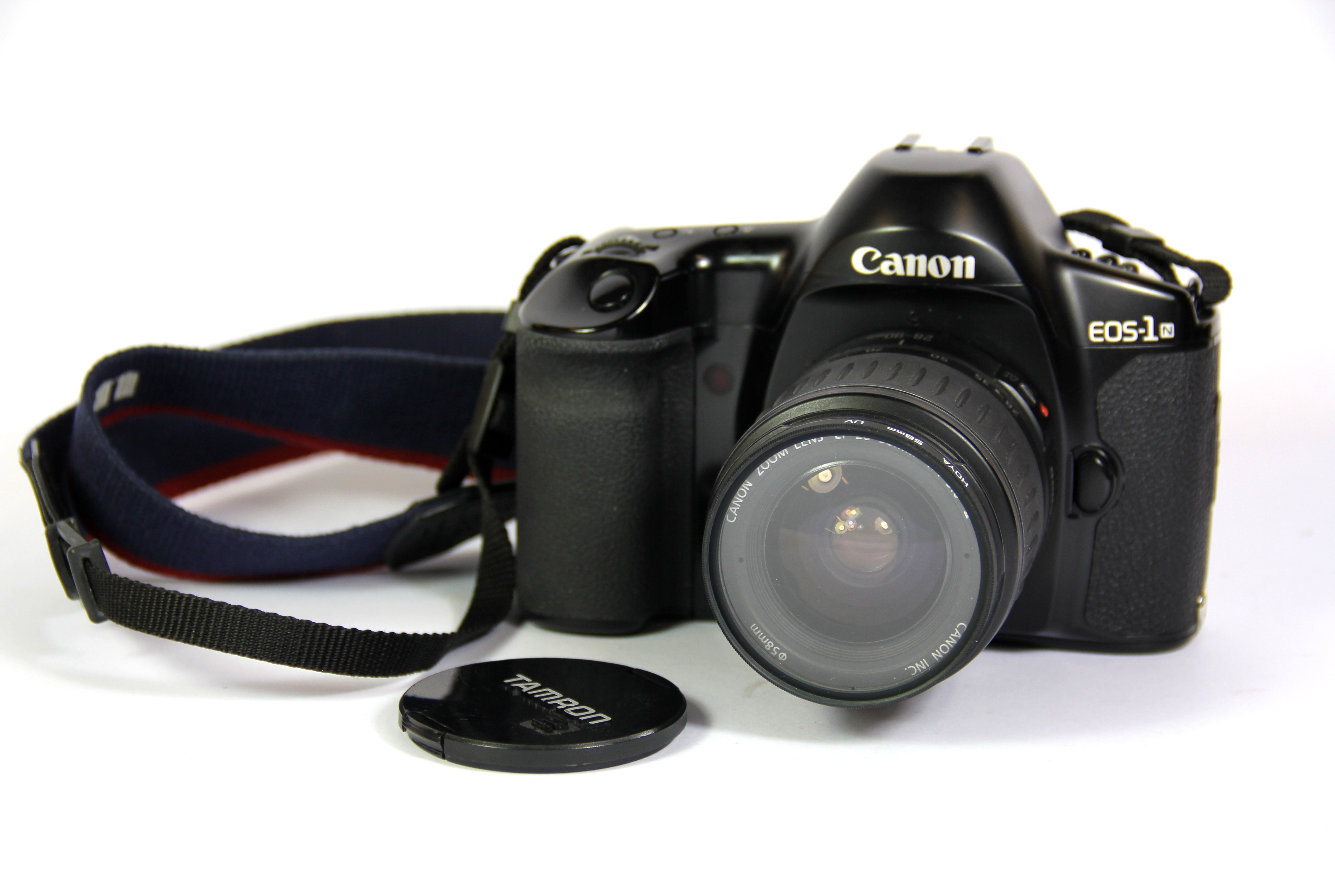 A Canon EOS-1 single lens reflex digital camera with Canon zoom lens.
