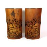 A pair of mid 20th century Chinese carved bamboo vases / brush pots, H. 25cm.