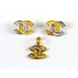 A 22ct yellow and white gold (stamped 916) set consisting of a matching pair of stud earrings and