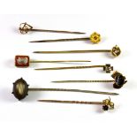 Eight antique 9ct gold diamond and stone set stick pins (approx. 10.5gr overall).