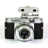 A Voigtlander VitoB camera with additional top view finder.