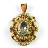 A yellow metal (stamped 14ct) aquamarine and ruby set pendant, L. 4.5cm.