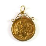 A 9ct yellow gold mounted Edward VII 1908 half sovereign set as a pendant (approx. 5.4gr).