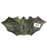 An interesting Chinese carved dark green jade model of a flying bat, W. 27cm.