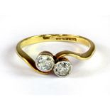 An 18ct yellow gold and platinum (stamped 18ct & plat) diamond set ring (M).