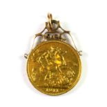 A yellow metal (tested minimum 9ct gold) mounted George V 1911 full sovereign set as a pendant.