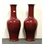 A pair of impressive 19th century Chinese Sang De Boeuf glazed porcelain vases, H. 73cm, old
