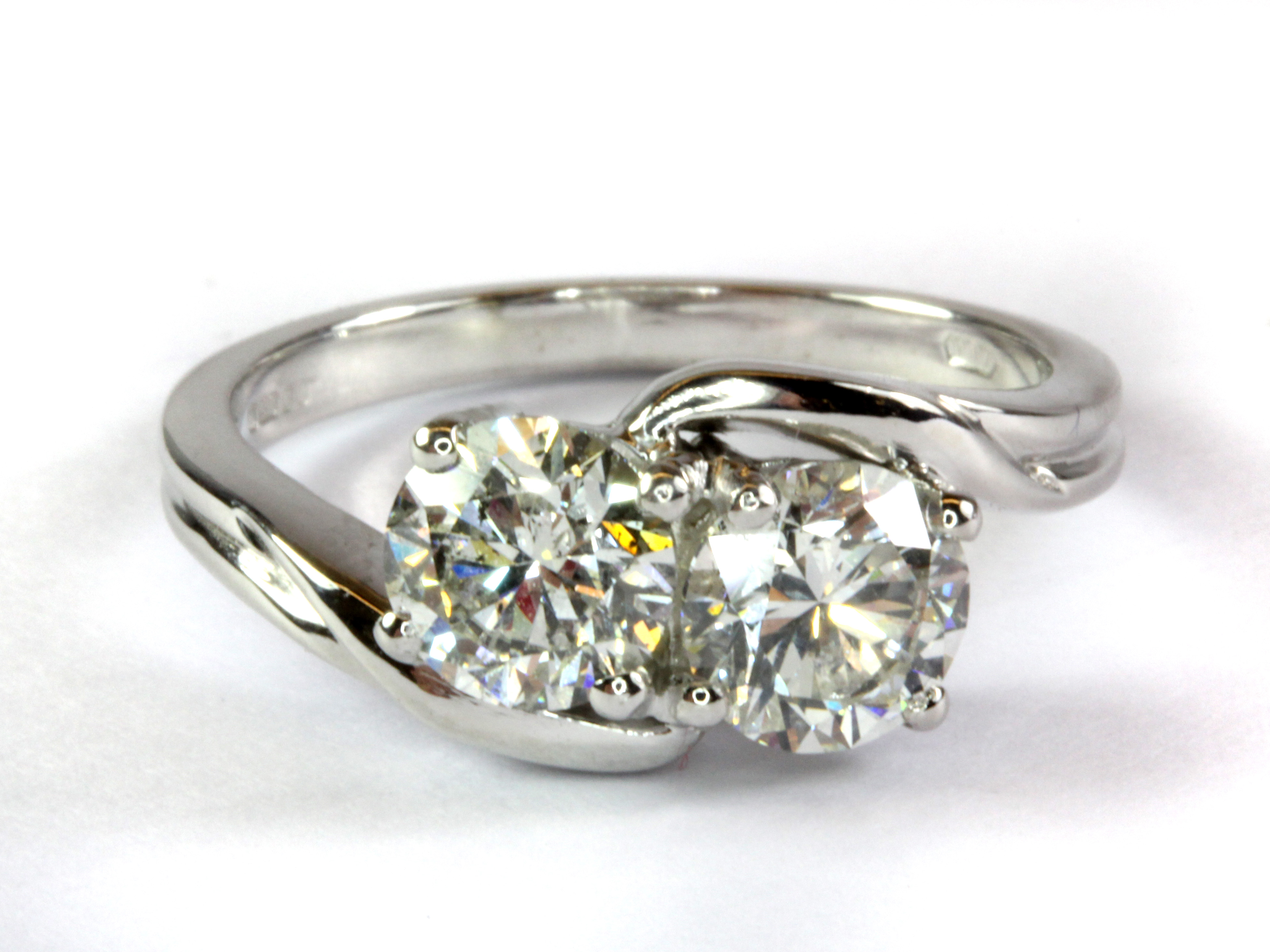 An impressive 18ct white gold (fully hallmarked) ring set with two diamonds in a crossover