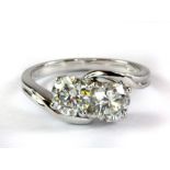 An impressive 18ct white gold (fully hallmarked) ring set with two diamonds in a crossover