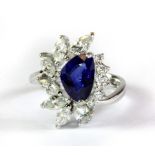A lovely 18ct white gold (stamped 750) ring set with a triangular sapphire (2.67ct) surrounded by