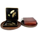 Four Japanese lacquer and wood trays and a Japanese wooden box.