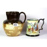 A Royal Doulton harvest jug and a Glyn Colledge signed tankard.