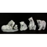 Four Lladro porcelain polar bear figures, tallest 12cm, with three boxes.