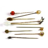 Nine antique 9ct gold diamond and stone set stick pins (approx. 10.9gr overall).