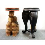 A carved hardwood elephant head table and a carved wooden elephant table, H. 51cm.