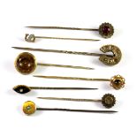 Eight antique 9ct gold diamond and stone set stick pins (approx. 12.7gr overall).