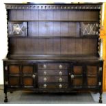 A Gothic style oak Welsh dresser, W. 167cm, H. 163cm.