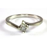 A 9ct white gold diamond solitaire ring (N.5).