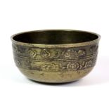 A 19th century Tibetan bronze alms bowl, Dia. 12.5cm, Depth. 6cm.