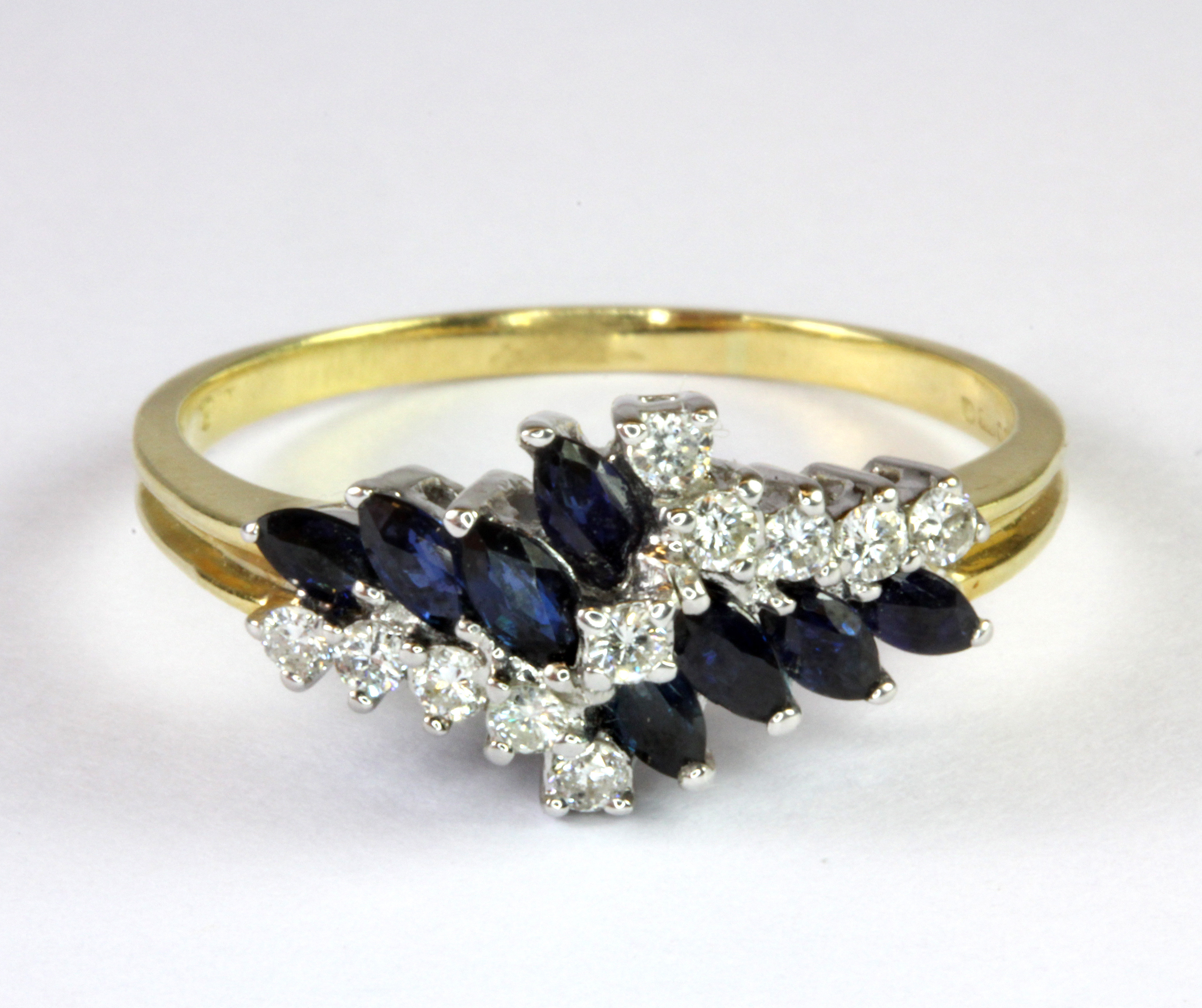 An 18ct yellow gold sapphire and diamond set ring (T).