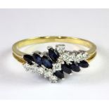 An 18ct yellow gold sapphire and diamond set ring (T).