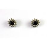 A pair of 9ct yellow gold sapphire and white stone cluster earrings.