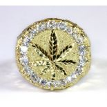 A gentleman's 10ct yellow gold (stamped 10k) stone set cannabis signet ring (approx. 10gr) (Y).