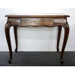 A 1920's lady's single drawer desk with inset glass top, W. 90 x 54 x H. 74cm.