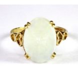 A 9ct yellow gold ring set with a cabochon cut opal (approx. 2.75ct opal) (N).