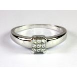 An 18ct white gold diamond set ring (P.5).