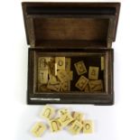 A quantity of rare 19th century double sided bone spelling game letters (vowels) with similar period